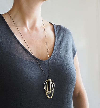 EQUI/06 six brass geometric shapes necklace